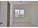 Simple bedroom with large window and sliding closet doors at 13064 Via Flavia, Placida, FL 33946