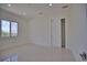 Simple bedroom with a window and closet at 13064 Via Flavia, Placida, FL 33946
