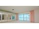Bright living room with water views and mirrored walls at 1884 Dolphin S Blvd, St Petersburg, FL 33707