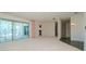 Living room with sliding doors leading to the pool and water views at 1884 Dolphin S Blvd, St Petersburg, FL 33707