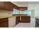 Kitchen features wood cabinets and a dishwasher at 1884 Dolphin S Blvd, St Petersburg, FL 33707