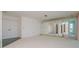 Spacious living room with mirrored wall and carpeted floor at 1884 Dolphin S Blvd, St Petersburg, FL 33707
