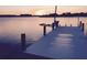 White wooden dock extending over calm water at 1884 Dolphin S Blvd, St Petersburg, FL 33707