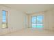 Bedroom with sliding doors leading to a pool and canal view at 1884 Dolphin S Blvd, St Petersburg, FL 33707