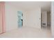 Bright bedroom with pale pink curtains and access to other rooms at 1884 Dolphin S Blvd, St Petersburg, FL 33707