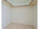 Large walk-in closet with hanging rods at 1884 Dolphin S Blvd, St Petersburg, FL 33707