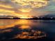Orange sunset reflecting on calm water at 1884 Dolphin S Blvd, St Petersburg, FL 33707