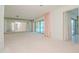 Bright living room with water views and sliding glass doors at 1884 Dolphin S Blvd, St Petersburg, FL 33707