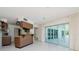 Kitchen with breakfast bar and pool access at 1884 Dolphin S Blvd, St Petersburg, FL 33707