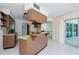 Kitchen with wood cabinets and a breakfast bar at 1884 Dolphin S Blvd, St Petersburg, FL 33707