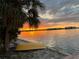 Sunset view with small yellow boat on shore at 1884 Dolphin S Blvd, St Petersburg, FL 33707