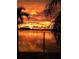 Stunning sunset over calm water with palm trees at 1884 Dolphin S Blvd, St Petersburg, FL 33707