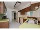 Retro kitchen with green countertops and wood cabinets at 1884 Dolphin S Blvd, St Petersburg, FL 33707