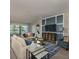 Spacious living room featuring a stylish TV wall and comfortable seating at 7643 Ginger Lily Ct, Tampa, FL 33619