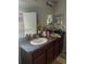 Double vanity bathroom with granite countertop at 7643 Ginger Lily Ct, Tampa, FL 33619