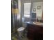 Bathroom features a toilet, sink, and shower at 7643 Ginger Lily Ct, Tampa, FL 33619