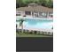 Community pool with spacious deck and lounge chairs at 7643 Ginger Lily Ct, Tampa, FL 33619