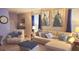 Spacious living room showcasing comfortable seating and stylish wall art at 7643 Ginger Lily Ct, Tampa, FL 33619