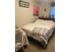 Bedroom with double bed and nightstand at 7643 Ginger Lily Ct, Tampa, FL 33619
