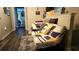Hallway with futon and built-in shelving for extra storage at 7643 Ginger Lily Ct, Tampa, FL 33619