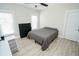 Bright bedroom with a queen bed, wood-look floors, and ample closet space at 1817 20Th S Ave, St Petersburg, FL 33712
