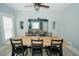 Bright dining room features a large wooden table with seating for six and view to living room at 1817 20Th S Ave, St Petersburg, FL 33712