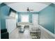 Living room with teal walls, sectional sofa and fireplace at 1817 20Th S Ave, St Petersburg, FL 33712
