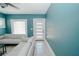 Modern front door with glass panels in teal living room at 1817 20Th S Ave, St Petersburg, FL 33712