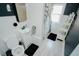 Clean bathroom with white vanity, shower, and window at 1817 20Th S Ave, St Petersburg, FL 33712