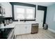 White kitchen with stainless steel appliances and sink at 1817 20Th S Ave, St Petersburg, FL 33712