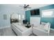Light and airy living room with teal walls and modern furniture at 1817 20Th S Ave, St Petersburg, FL 33712