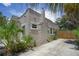 Side view of Spanish style home with stucco exterior and landscaping at 1817 20Th S Ave, St Petersburg, FL 33712