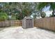 Gray shed with double doors in fenced backyard at 1817 20Th S Ave, St Petersburg, FL 33712