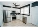 Modern kitchen with stainless steel appliances and white cabinetry at 1817 20Th S Ave, St Petersburg, FL 33712