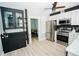 Modern kitchen with stainless steel appliances and dark cabinetry at 1817 20Th S Ave, St Petersburg, FL 33712