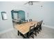 Long wooden dining table with black chairs in dining area at 1817 20Th S Ave, St Petersburg, FL 33712