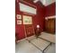 Spacious bedroom with a large window and dark red walls at 2412 Summercrest Ln, Spring Hill, FL 34606