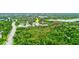 Aerial view of condo community and surrounding lush green landscape at 2745 Enterprise E Rd # 24, Clearwater, FL 33759