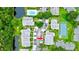 Aerial view of condo community, pool, tennis court, and lush landscaping at 2745 Enterprise E Rd # 24, Clearwater, FL 33759