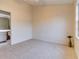 Well-lit bedroom with carpet flooring and access to a bathroom at 2745 Enterprise E Rd # 24, Clearwater, FL 33759