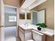 Clean bathroom with single sink vanity, toilet and view into bedroom at 2745 Enterprise E Rd # 24, Clearwater, FL 33759