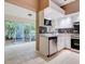 Kitchen with stainless steel appliances and access to a patio at 2745 Enterprise E Rd # 24, Clearwater, FL 33759