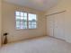 Spacious bedroom with large window and double-door closet at 2745 Enterprise E Rd # 24, Clearwater, FL 33759