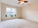 Spacious living room featuring a large window and ceiling fan at 2745 Enterprise E Rd # 24, Clearwater, FL 33759