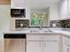 Kitchen with stainless steel appliances and mosaic backsplash at 2745 Enterprise E Rd # 24, Clearwater, FL 33759
