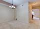 Dining room with carpet, chandelier, and storage closet at 2745 Enterprise E Rd # 24, Clearwater, FL 33759