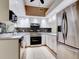Modern kitchen with stainless steel appliances and mosaic backsplash at 2745 Enterprise E Rd # 24, Clearwater, FL 33759