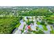 Aerial view of condo community showing location, pool, tennis court at 2745 Enterprise E Rd # 24, Clearwater, FL 33759