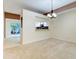 Dining area with a chandelier and a kitchen pass-through at 2745 Enterprise E Rd # 24, Clearwater, FL 33759