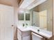 Modern bathroom with a large vanity, toilet, and recessed lighting at 2745 Enterprise E Rd # 24, Clearwater, FL 33759